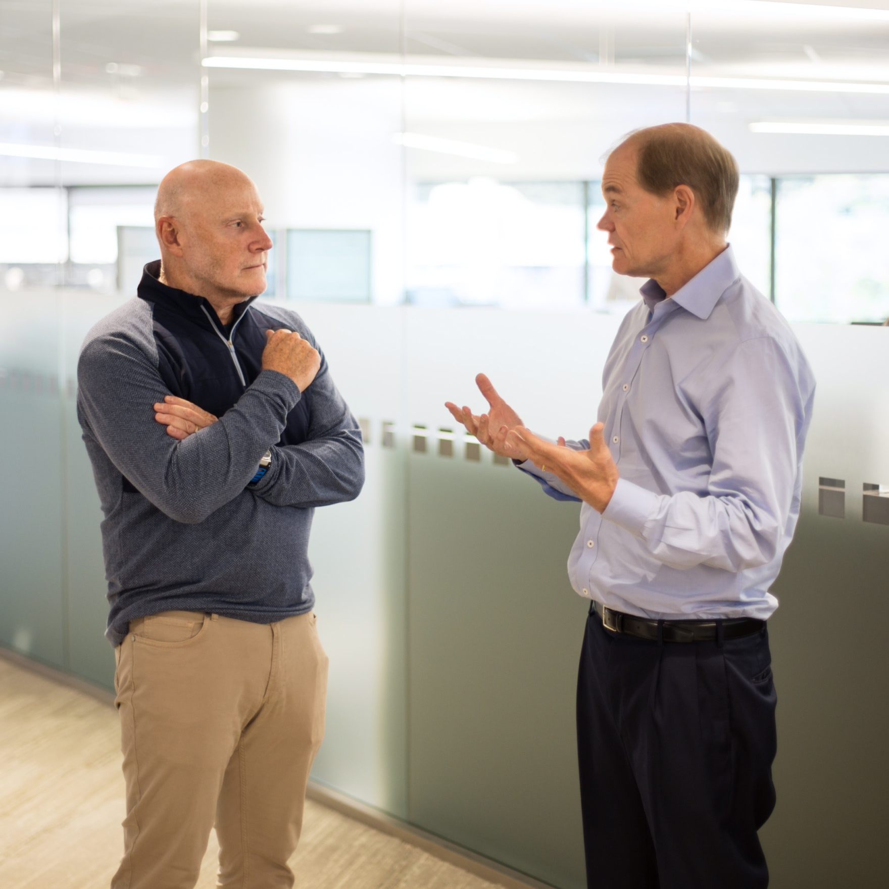 Two men having a business discussion indoors