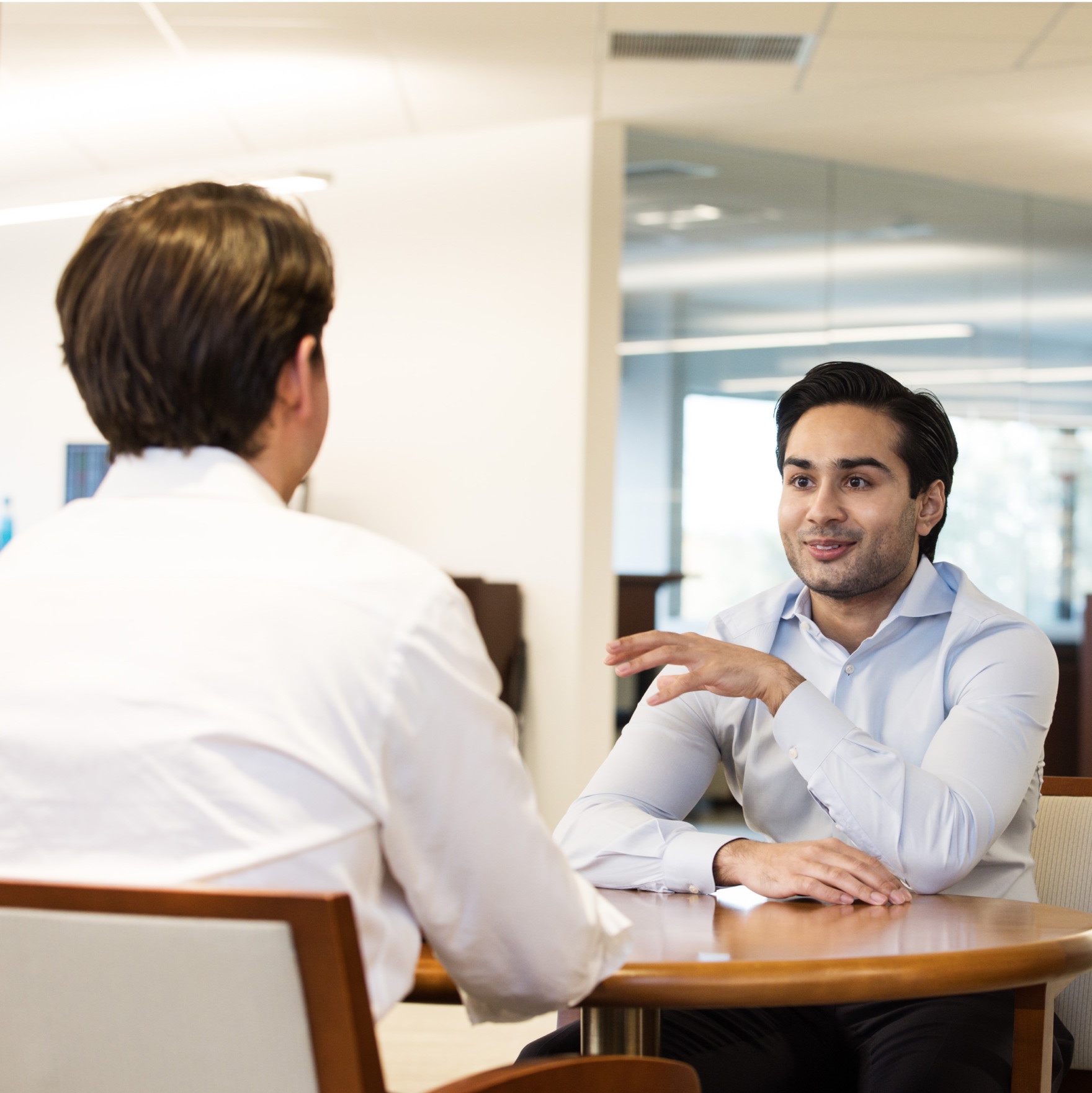 Two professionals having a business meeting conversation