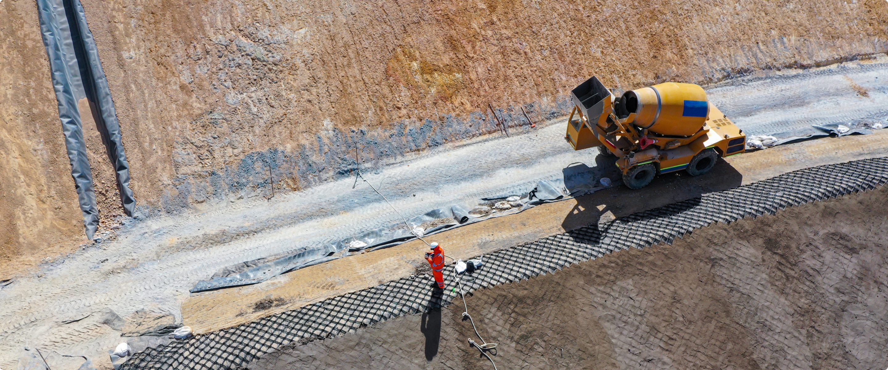 Aerial view of road construction with machinery
