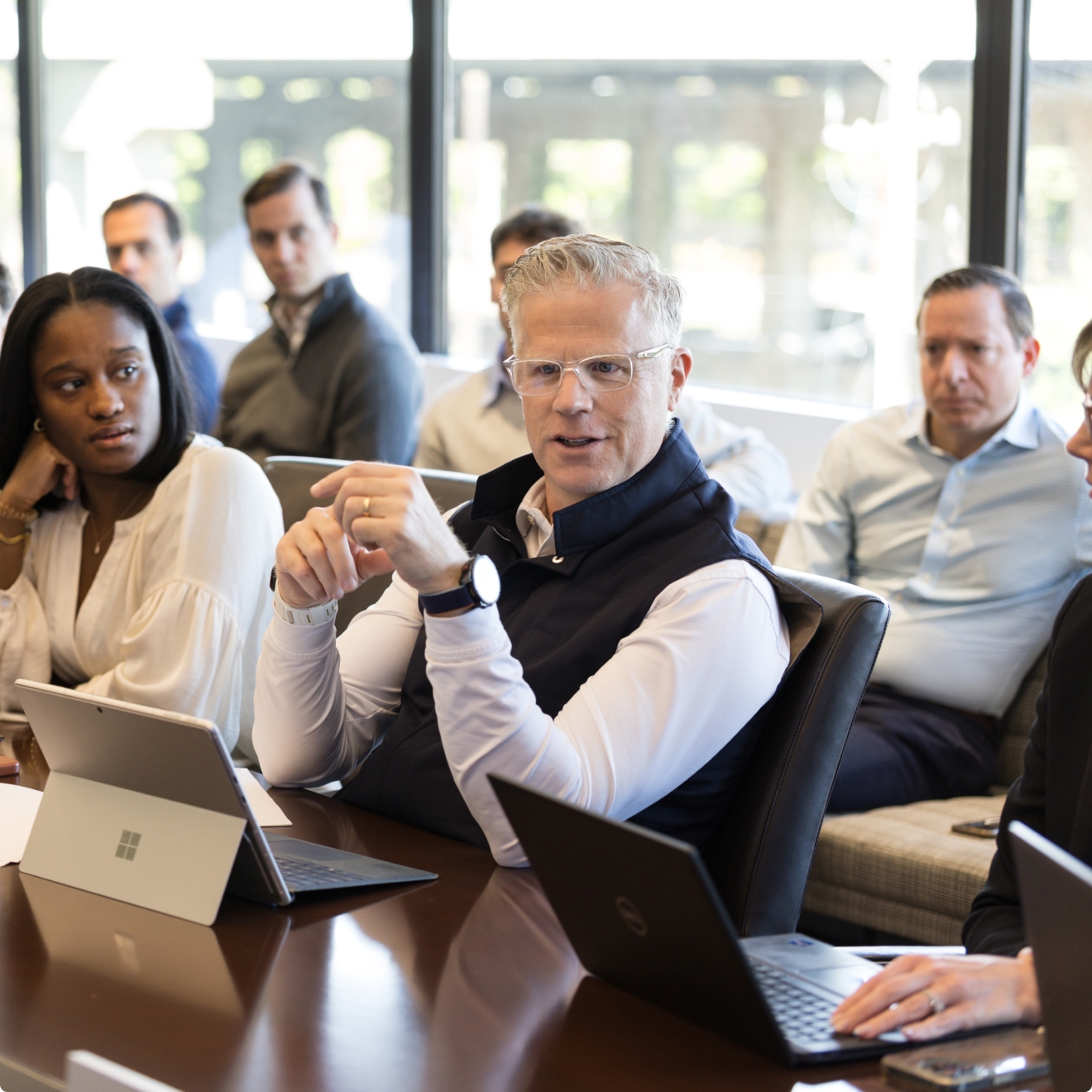 People engaged in a business meeting discussion.
